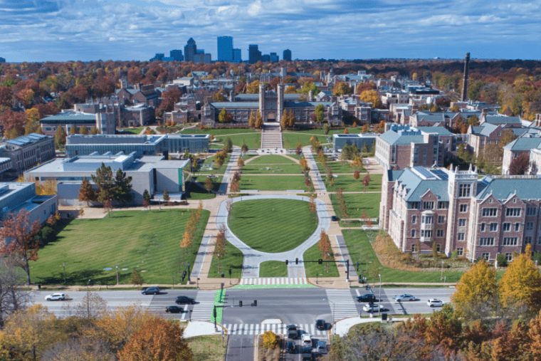 Aerial view of Washington University in St. Louis with city skyline in background